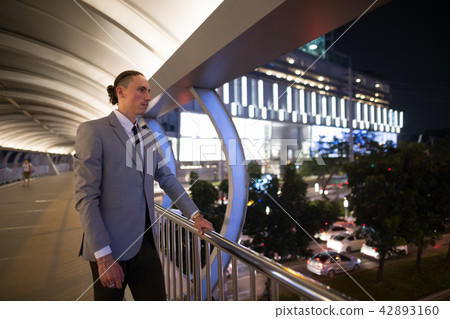Young Handsome Businessman Outdoors At Night 42893160