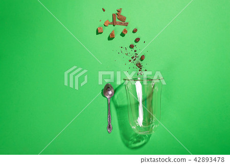 cappuccino glass cup with sugar and coffee beans 42893478