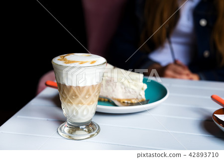 Glass of Latte macchiato with rich milk foam Glass of Latte macchiato with rich milk foam 42893710