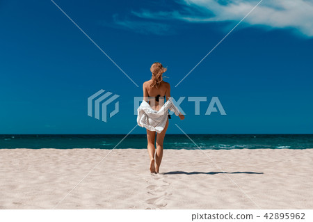 woman on sea beach woman on sea beach 42895962