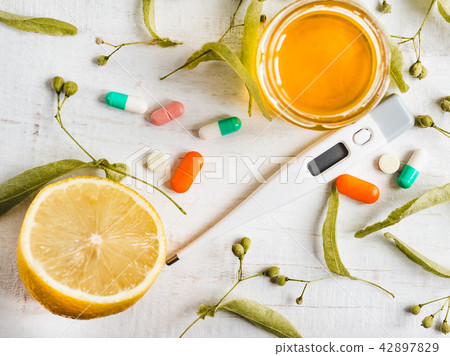 Electric thermometer, pills, lemon. Concept of prevention of colds Electric thermometer, pills, lemon. Concept of prevention of colds 42897829