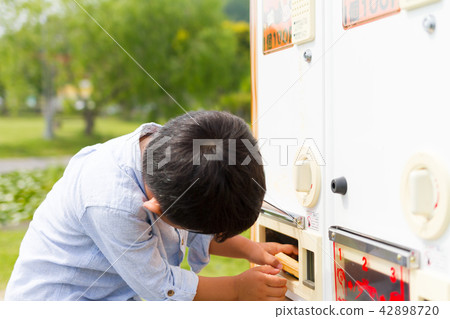 Boys buying ducks and carp baits 42898720