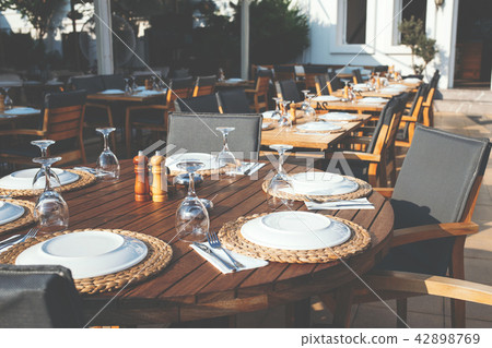 Setting table in restaurant. Setting table in restaurant. 42898769