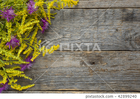 Autumn flowers on wooden rustic background. Autumn flowers on wooden rustic background. 42899240