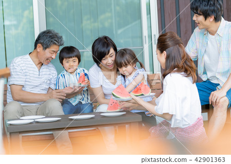 Three generations family, meal, watermelon, summer 42901363