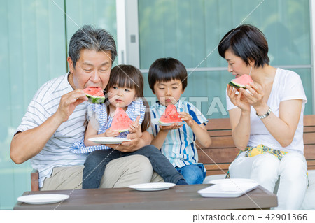 Three generations family, meal, watermelon, summer Three generations family, meal, watermelon, summer 42901366