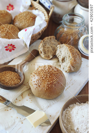 Fresh homemade sourdough bread buns with sesame 42901697