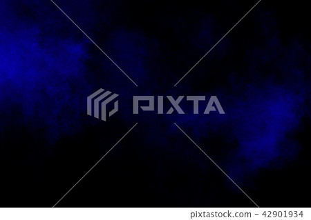 Abstract blue dust explosion on black background 42901934