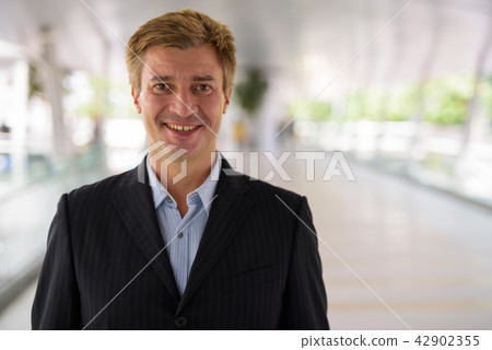 Businessman relaxing at the footbridge in Bangkok, Thailand Businessman relaxing at the footbridge in Bangkok, Thailand 42902355