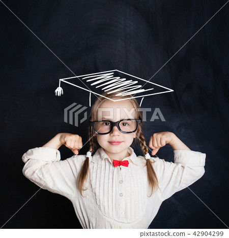 Kid of school age in graduation hat Kid of school age in graduation hat 42904299