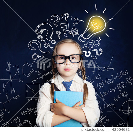 Cheerful child at the blackboard with lightbulb 42904681