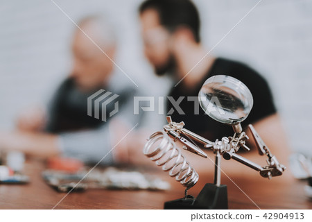 Two Men Repairing Hardware Equipment from PC. Two Men Repairing Hardware Equipment from PC. 42904913
