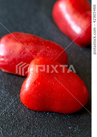 Fresh red bell pepper slices 42905466