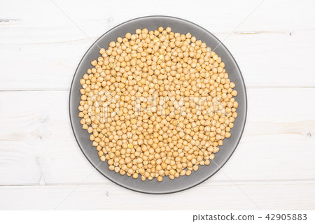 Raw chickpeas kabuli on grey wood 42905883