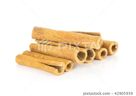 Dry brown cinnamon stick isolated on white Dry brown cinnamon stick isolated on white 42905939