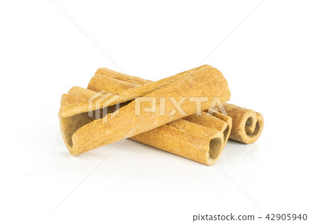 Dry brown cinnamon stick isolated on white Dry brown cinnamon stick isolated on white 42905940