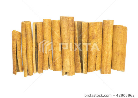 Dry brown cinnamon stick isolated on white Dry brown cinnamon stick isolated on white 42905962