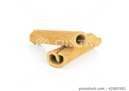 Dry brown cinnamon stick isolated on white Dry brown cinnamon stick isolated on white 42905981