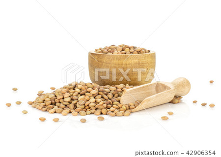 Raw green lentil seeds isolated on white Raw green lentil seeds isolated on white 42906354