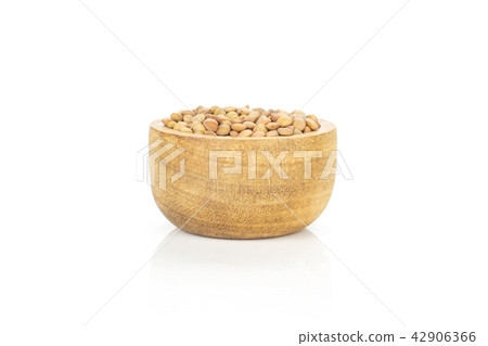 Raw green lentil seeds isolated on white Raw green lentil seeds isolated on white 42906366