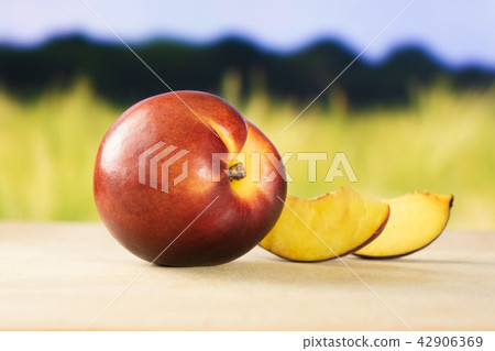 Ripe deep red nectarine Ripe deep red nectarine 42906369