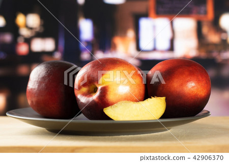 Ripe deep red nectarine 42906370