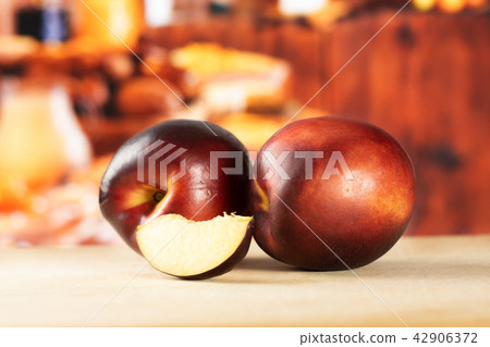 Ripe deep red nectarine Ripe deep red nectarine 42906372