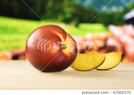 Ripe deep red nectarine Ripe deep red nectarine 42906376