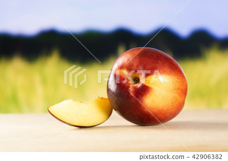 Ripe deep red nectarine Ripe deep red nectarine 42906382