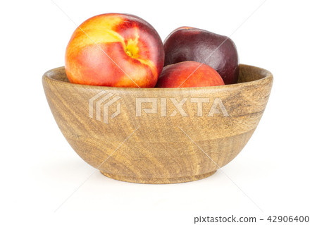 Ripe deep red nectarine isolated on white Ripe deep red nectarine isolated on white 42906400