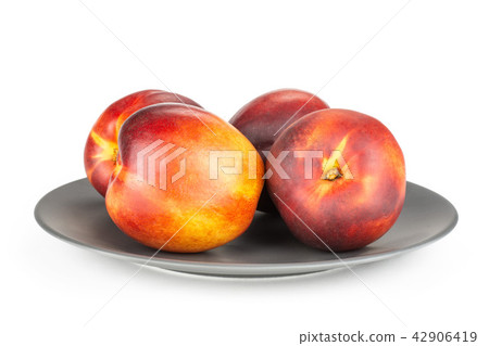 Ripe deep red nectarine isolated on white Ripe deep red nectarine isolated on white 42906419
