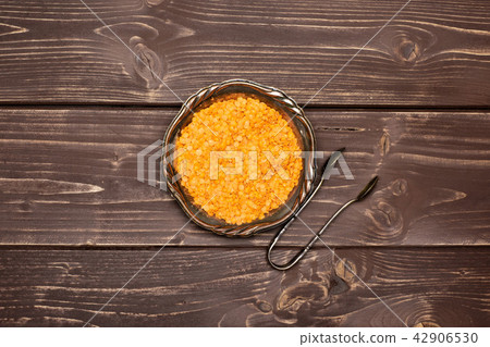 Raw red lentils on brown wood 42906530