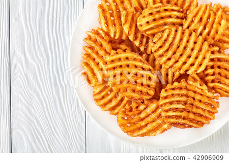 Crispy Potato Waffles Fries, flat lay Crispy Potato Waffles Fries, flat lay 42906909