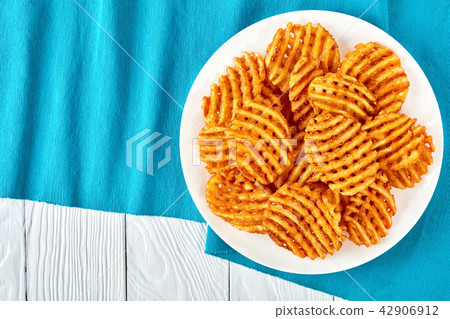 Crispy Potato Waffles Fries on a plate Crispy Potato Waffles Fries on a plate 42906912