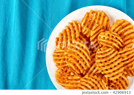 Crispy Potato Waffles Fries on a plate Crispy Potato Waffles Fries on a plate 42906913