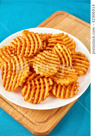 Criss Cross Fries on a white plate Criss Cross Fries on a white plate 42906914