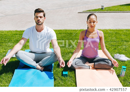 Pleasant young people meditating 42907557