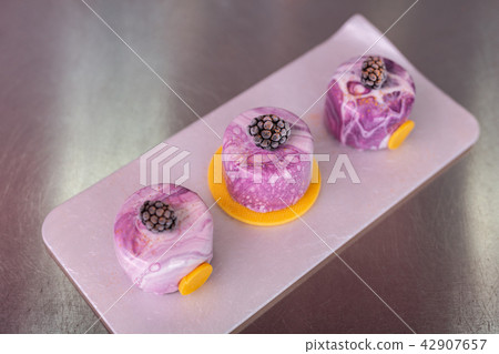 Top view of perfect blueberry cakes with mirror icing Top view of perfect blueberry cakes with mirror icing 42907657