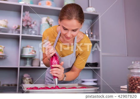 Beautiful woman working hard in professional kitchen Beautiful woman working hard in professional kitchen 42907820