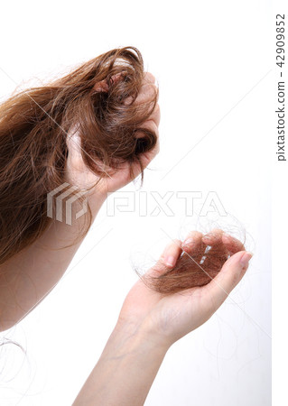 Long colorful hair with objects related to hair salon on close up isolated on background. 124 42909852