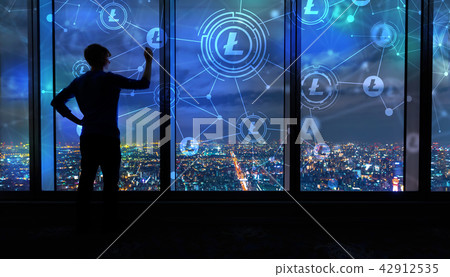 Litecoin with man by large windows at night Litecoin with man by large windows at night 42912535