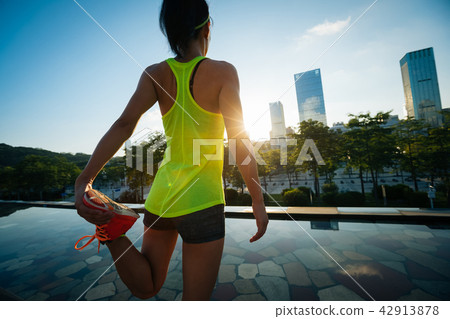 woman runner warming up before running 42913878