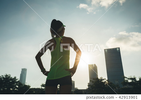 woman looking at the viw in sunrise city woman looking at the viw in sunrise city 42913901