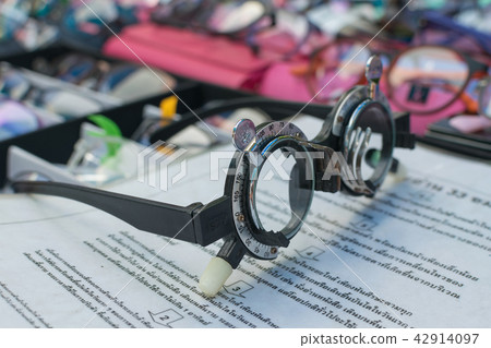 Glass optometry test and many types of glasses 42914097