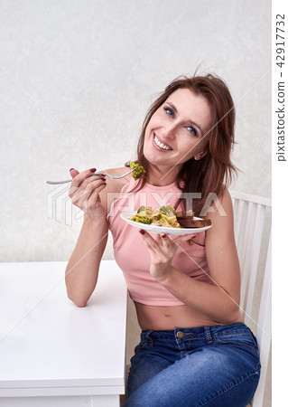 Beautiful young woman eating seaweed salad. Dieting concept. Healthy Food 42917732
