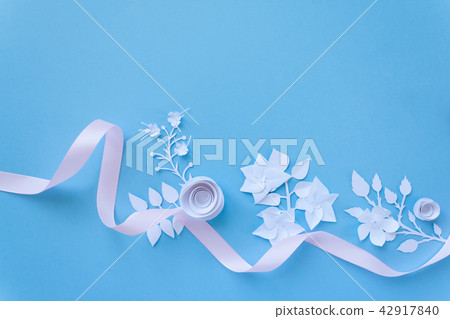 frame with white paper flowers and pink ribbon frame with white paper flowers and pink ribbon 42917840