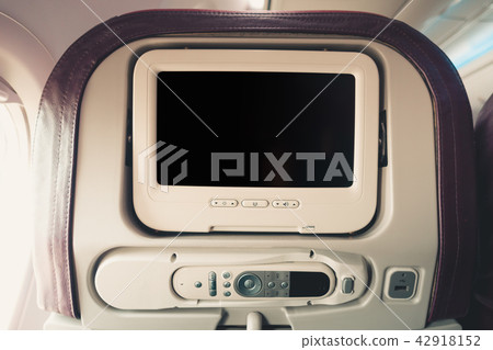 LCD screen monitor in an airplane seat  42918152