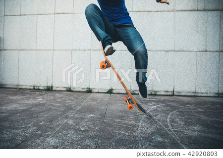 one skateboarder skateboarding on city 42920803