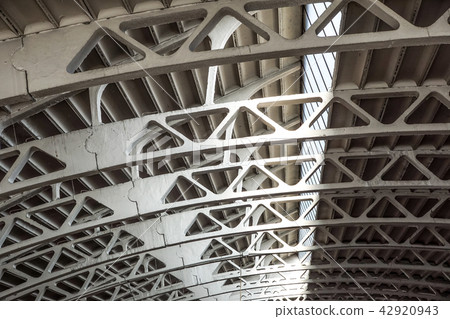 Old arched metal structure. Industrial geometry. 42920943