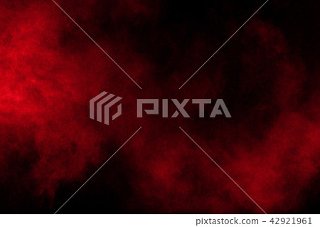 Abstract red powder explosion on dark background. 42921961